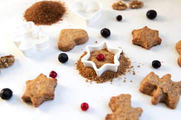 Fototapeta na wymiar pile of gingerbread with star mold and cookies