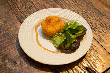 Ballotine de chevre (goat cheese, French) fried with honey sauce.