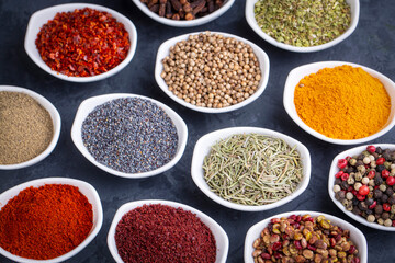 Various spices on black background