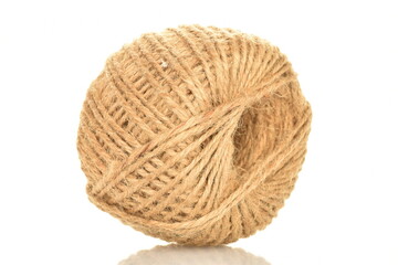 Obraz premium One whole skein of jute thread, close-up, isolated on white.