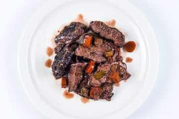 pork cheek cooked with red wine at low temperature typical dish of Lazio and Toscana region in Italy