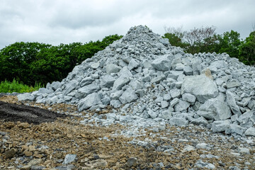 A pile of building crushed stone crushed stone at a construction site