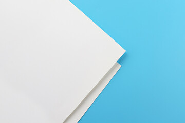 Blank note paper on blue background.