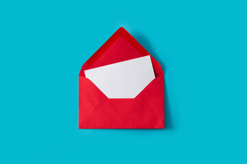 Paper note inside red envelope on blue background