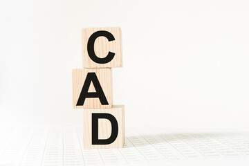 a word CAD on wooden cubes. business concept. business and Finance