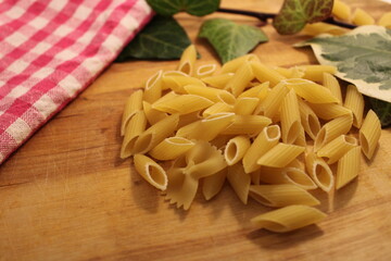 uncooked pasta italian pasta raw pasta with vegetables on table