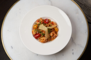 Spaghetti pasta with tomato, shrimps and cheese