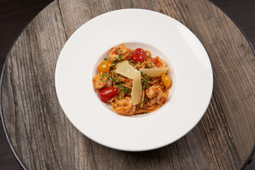 Spaghetti pasta with tomato, shrimps and cheese