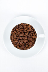 A cup of coffee beans isolated on a white background.
