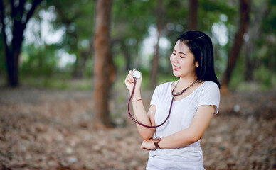 Hand and heart pressure monitor and are smiling happily in a healthy body