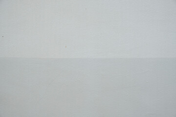 Gray painted concrete wall texture background with 2 shades. Stock Photo.