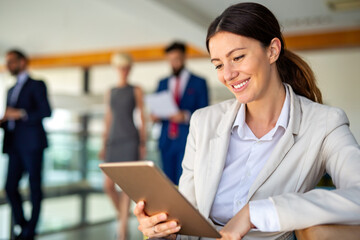 Obraz na płótnie Canvas Attractive businesswoman using a digital tablet in office