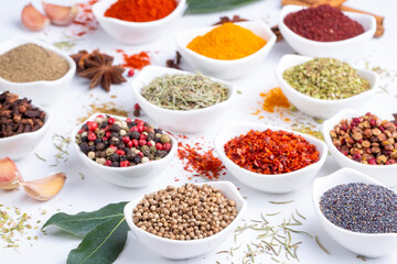 Assorted various spices on white background