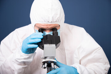 Scientist researcher using microscope in laboratory. Medical healthcare technology and pharmaceutical research and development concept.