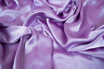 Violet satin background and texture. Grooved of blue fabric abstract. Top view with empty space.