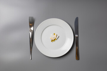 Tablets on a plate as a meal