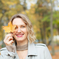 Beautiful girl in autumn park