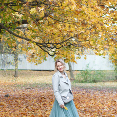 Beautiful girl in autumn park