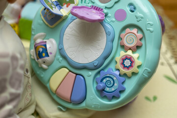 Baby hand playing with toy. Little baby hand pianist plays on a colorful toy piano.