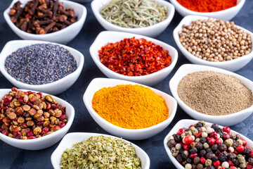 Various spices on black background