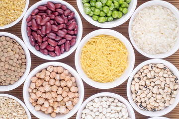 Mixed dried legumes and cereals isolated on white background, top view