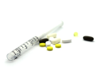 medicines medicines pills syringe spray on white background