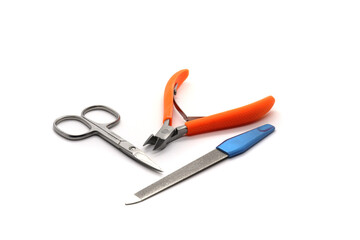 nail clippers ear sticks and nail file on white background