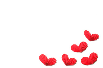 Few handmade red accordion folded paper hearts on white background isolated. Love, Valentine's,...