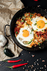 Fried eggs and bacon for breakfast on a plate, top view, 