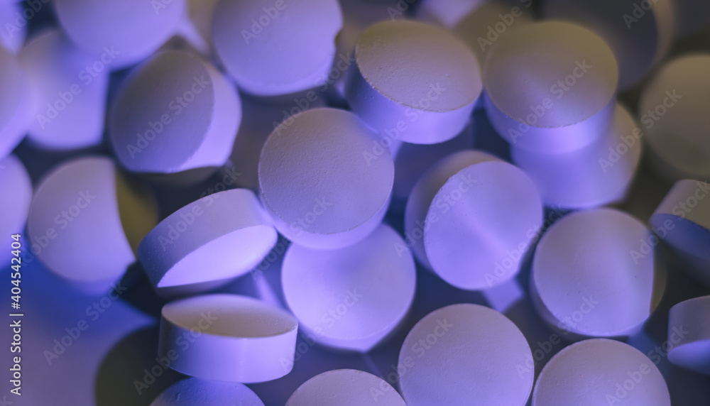 Poster pills or drugs in a package under neon light. beautiful background pattern for design.