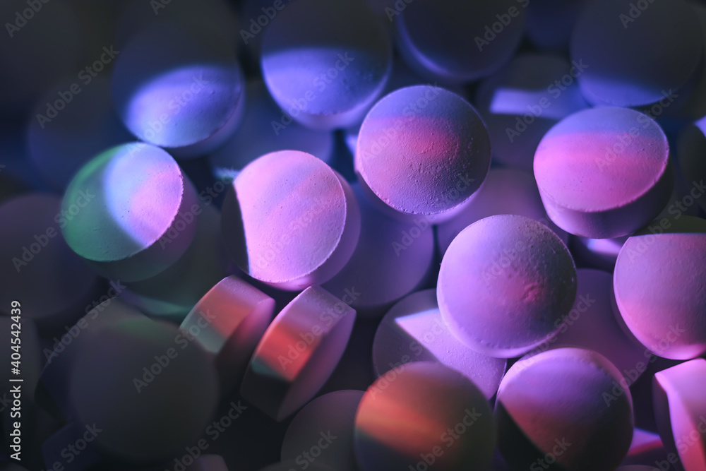 Poster pills or drugs in a package under neon light. beautiful background pattern for design.