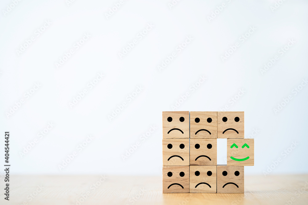 Poster Select emotion or mood concept , Smile face which print screen on wooden cube block move out  from sad emotion.
