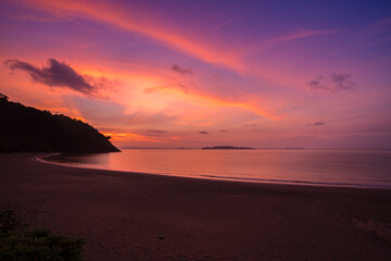Fototapeta na wymiar Sunrise on beach under colorful sky at Tropicana country