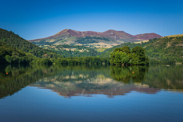 Puy de Sancy volcano reflection into the Lake Chambon in Chambon sur le Lac, Auvergne (France)