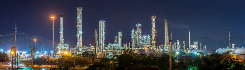 Fototapeta na wymiar Oil refinery with water vapor in Hamburg, Germany, petrochemical industry at night.
