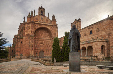 Fototapeta na wymiar Facade of the Convent of San Esteban and honorary statue to Francisco e Vitoria, from the city of Salamanca, Castilla y León, Spain, photograph taken in winter 2020 (December-January)