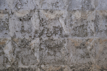 Peeling old paint on a concrete wall. Abstract background. Space for lettering or design