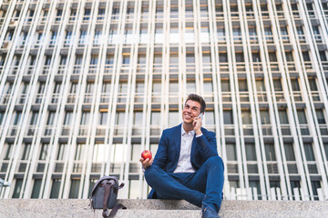 Latino Businessman Having Phone Call Outdoors.