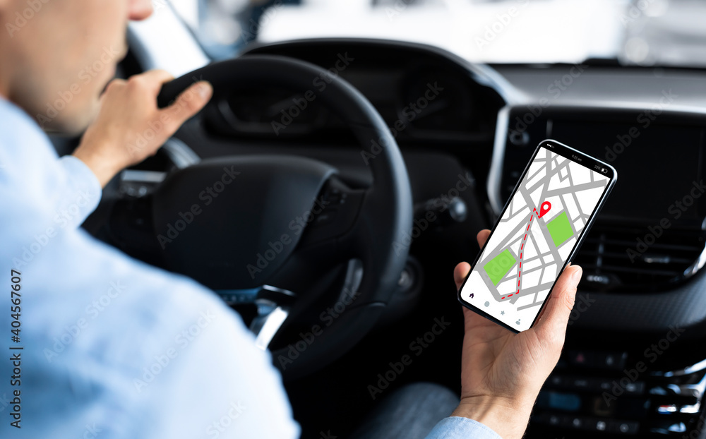 Poster gps service app. male driver using navigation application on smartphone in car