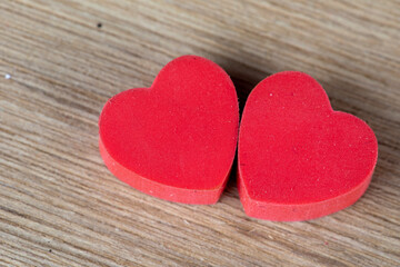 Fototapeta na wymiar Valentines day background with two red hearts 