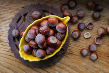 Hazelnuts, filbert in burlap sack on wooden backdrop. heap or stack of hazelnuts. Hazelnut background, healty food
