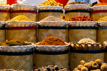 Variety of colorful Arabic spices and herbs on the arab street market stall. Dubai Grand Spice Souk, United Arab Emirates.