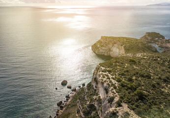Seascape Aerial Shot saddle of the devil (sella del diavolo) with calm sea in Caglairi - Sardinia.