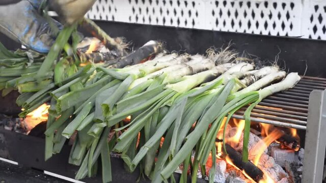 Cooking traditional catalan food grill: cal&ccedil;ots