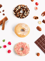 Creative layout made of donuts, nuts and strawberry. Flat lay. Food concept. Macro  concept.