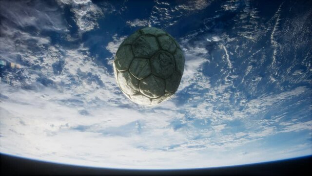 old soccer ball in space on Earth orbit. elements furnished by Nasa