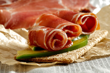 Fresh Serrano ham on the table in the light of the morning sun