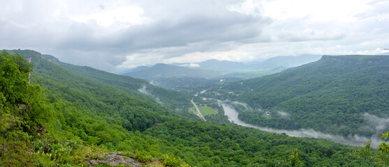 Travel through the national Park in the mountains on a sunny day, early in the morning; panorama of the area.