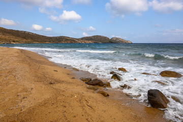Fototapeta na wymiar Psathi Beach, a large, sandy and isolated beach on the east coast of Ios island. Cyclades, Greece