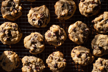 Chocolate chip cookies cooling on a baking rack